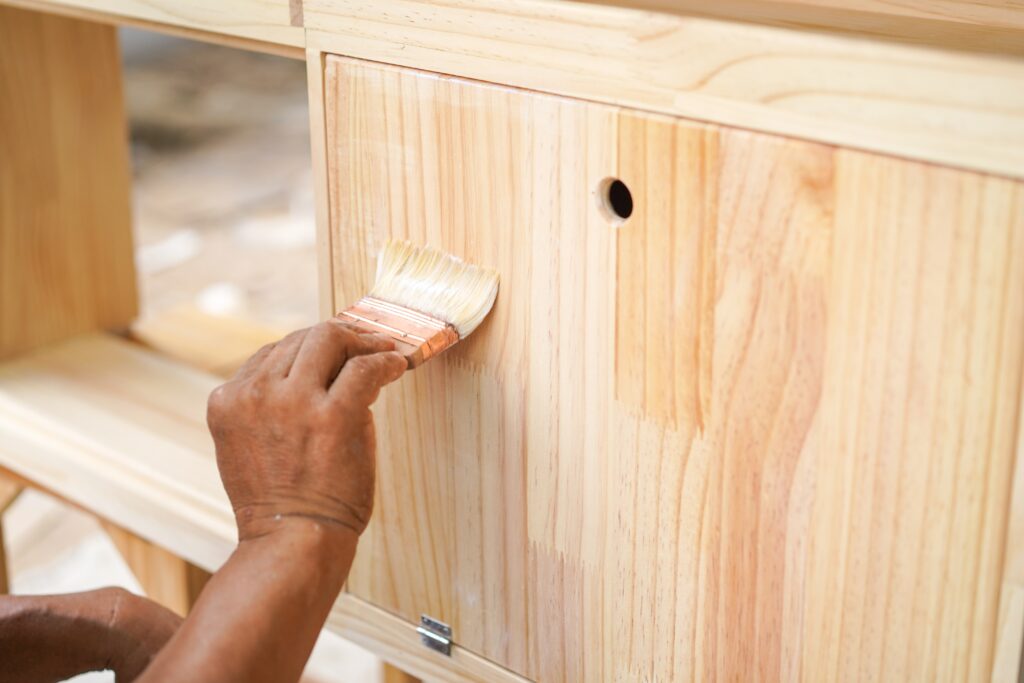 a person varnishing furniture