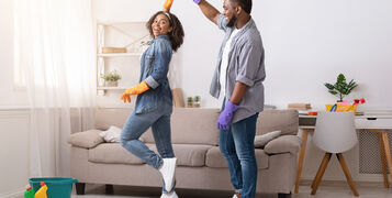 Loving,African,American,Couple,Dancing,While,Cleaning,Flat,Together,,Having