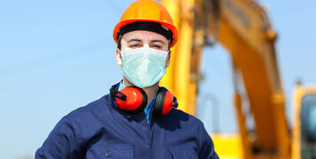 Masked,Man,At,Work,In,A,Construction,Site,,Covid,Coronavirus