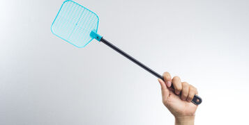 Hand,Holding,Fly,Or,Insect,Swatter,On,White,Background