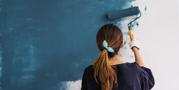 Young,Asian,Happy,Woman,Painting,Interior,Wall,With,Paint,Roller