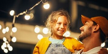 Proud,Handsome,Father,Helping,His,Little,Beautiful,Daughter,To,Change